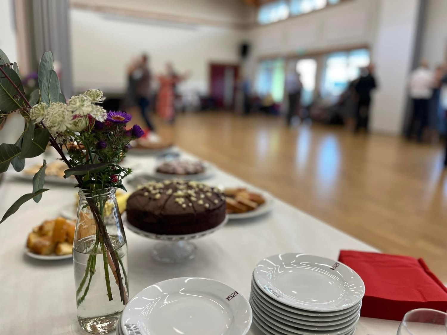 Cakes and flowers at a community gathering