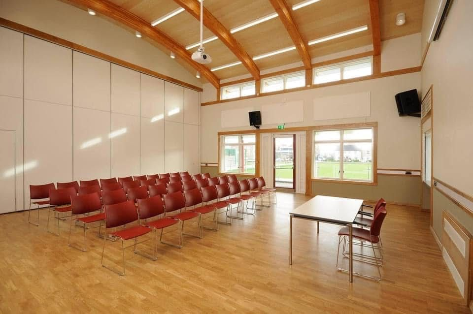 The Gordon Hall with rows of chairs and partition wall