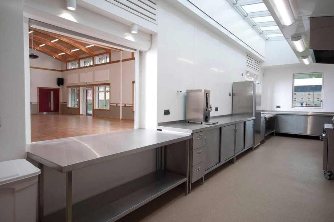 Kitchen serving area with hatch opening into the Gordon Hall